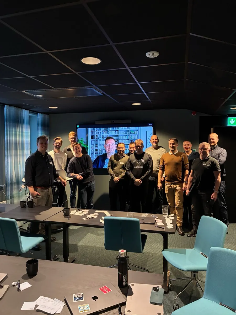 Group photo after a workshop with Fredric Lundberg and a speaker on screen